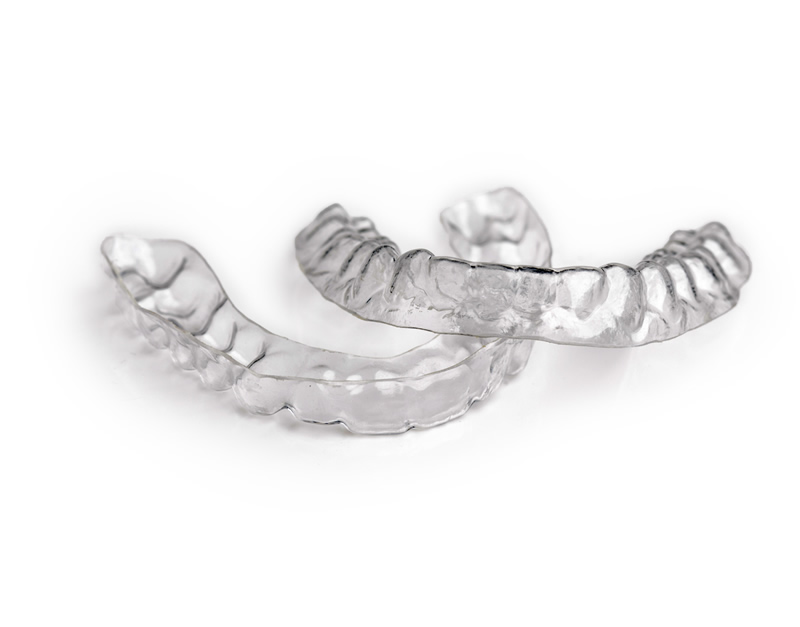 Table top image of top and bottom clear aligners.