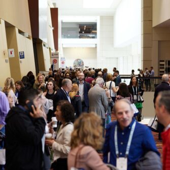 Annual Session Conference attendees walking through the convention center.