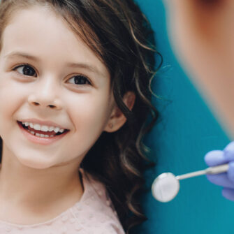 Young girl at the orthodontist for her first appointment