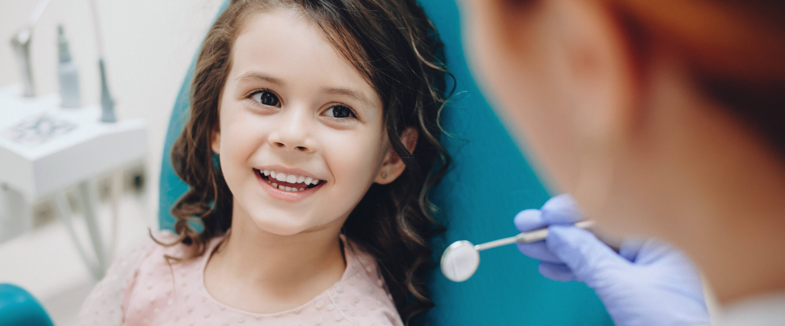 Young girl at the orthodontist for her first appointment