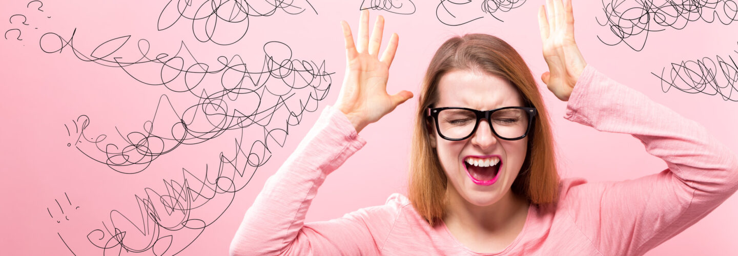 Woman confused and frustrated with understanding which type of orthodontic appliance to use. See an AAO orthodontist for help!