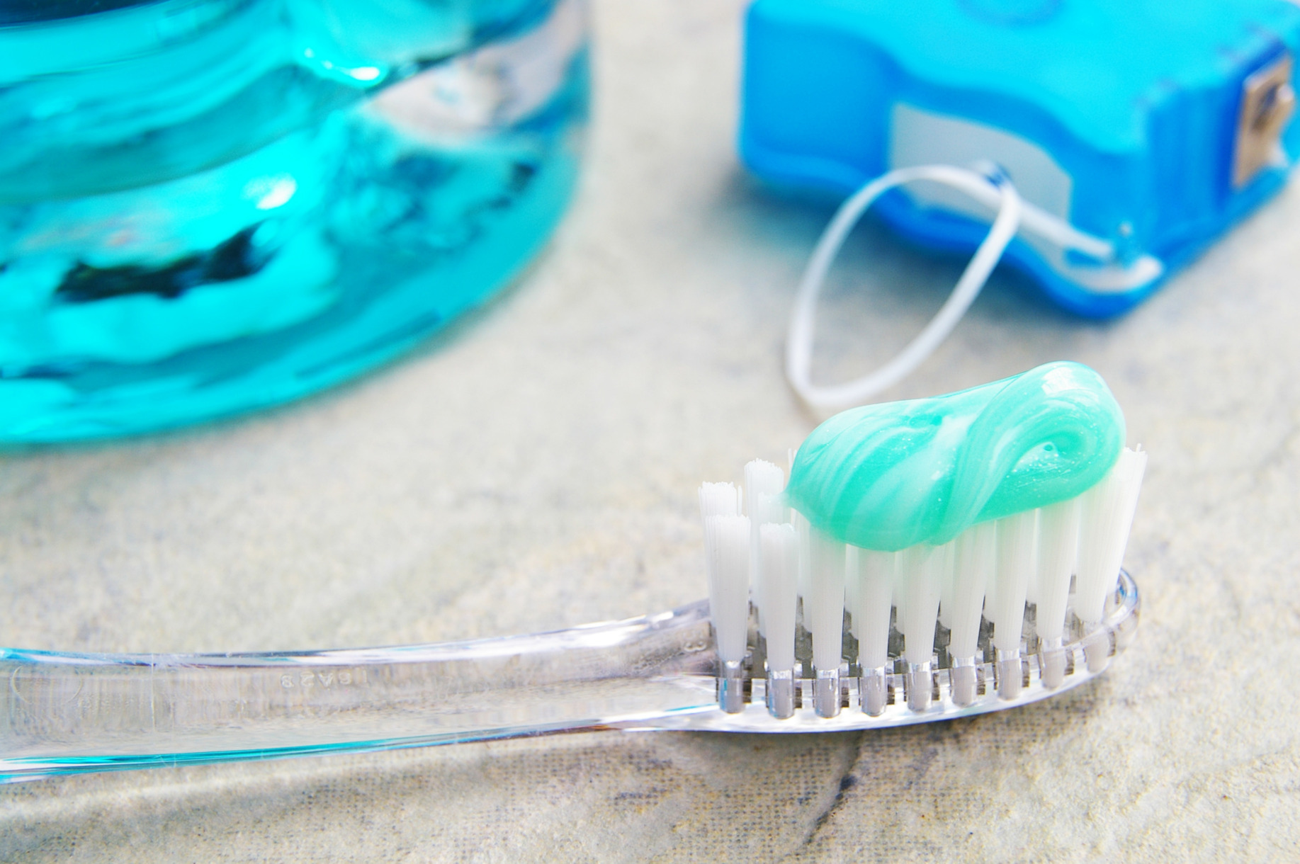 Tools you need to keep your teeth clean while travelling-like a toothbrush, floss, and mouthwash.